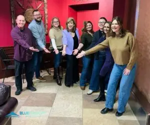 Blue Canopy Marketing team and other attendees posing with Heidi Parr Kerner at her Sales Training for Professionals session.